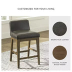 Signature Design by Ashley Cabalynn, tabouret de bar à hauteur de comptoir en similicuir, avec cadre en bois massif, deux tons de marron, lot de 2