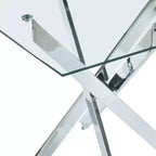 Table à manger avec pieds croisés en métal et plateau en verre trempé, 90x90x75cm, design moderne et peu encombrant pour cuisine ou salon