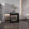 Crafted for both style and function, this Night Table 16.5H, 1 spacious Shelf, Black is a compact bedside table that helps keep your space.