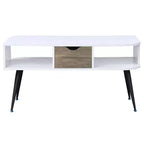Table basse moderne blanche et noire avec 1 tiroir, deux compartiments ouverts et pieds en métal thermolaqué pour salon