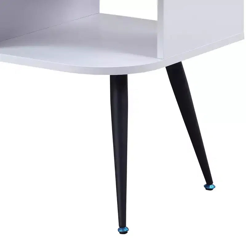 Table basse moderne blanche et noire avec 1 tiroir, deux compartiments ouverts et pieds en métal thermolaqué pour salon