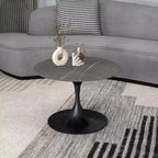 Table basse ronde Verve 27 de LeisureMod - Plateau en pierre frittée et piètement en acier noir moderne, table d'appoint pour salon contemporain