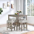 Table carrée en bois massif avec quatre chaises de salle à manger rembourrées