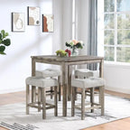 Table carrée en bois massif avec quatre chaises de salle à manger rembourrées