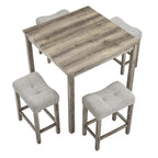 Table carrée en bois massif avec quatre chaises de salle à manger rembourrées