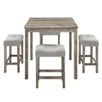 Table carrée en bois massif avec quatre chaises de salle à manger rembourrées
